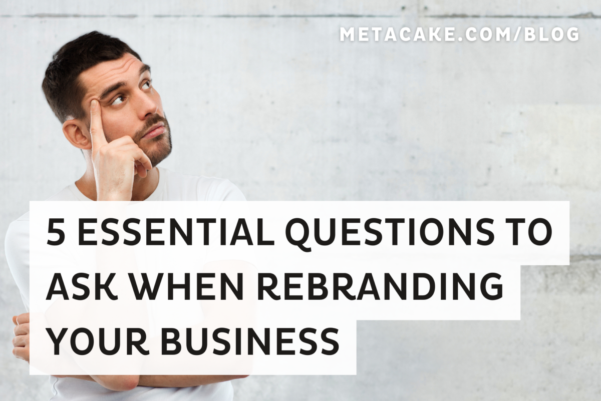 A man with dark hair looks up while thinking of questions to ask himself when rebranding.