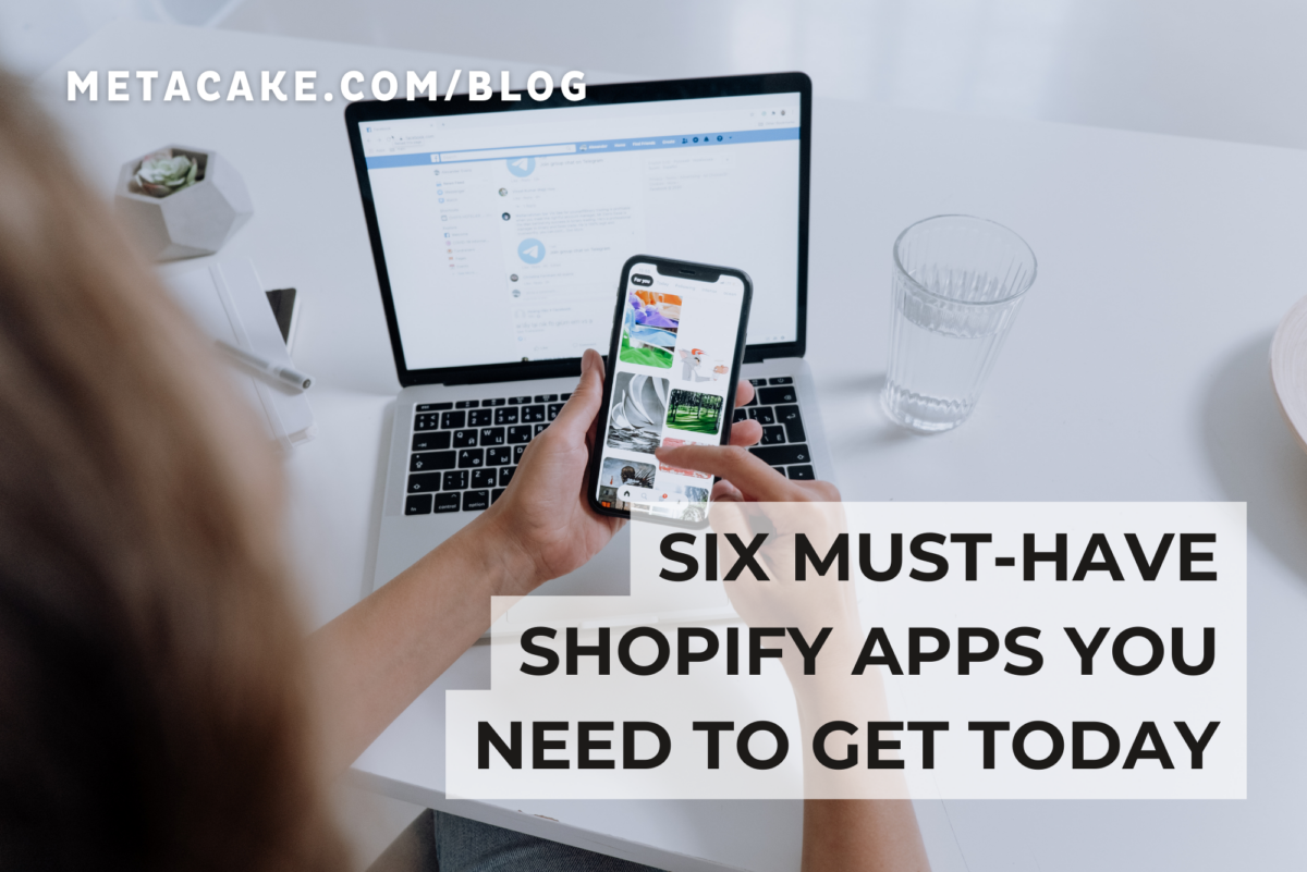 Person on phone using must-have Shopify apps.