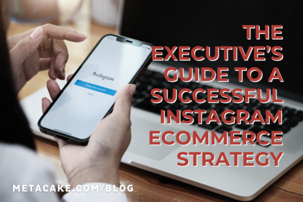 Person using Instagram app on a smartphone with a laptop in the background for Instagram ecommerce strategy.
